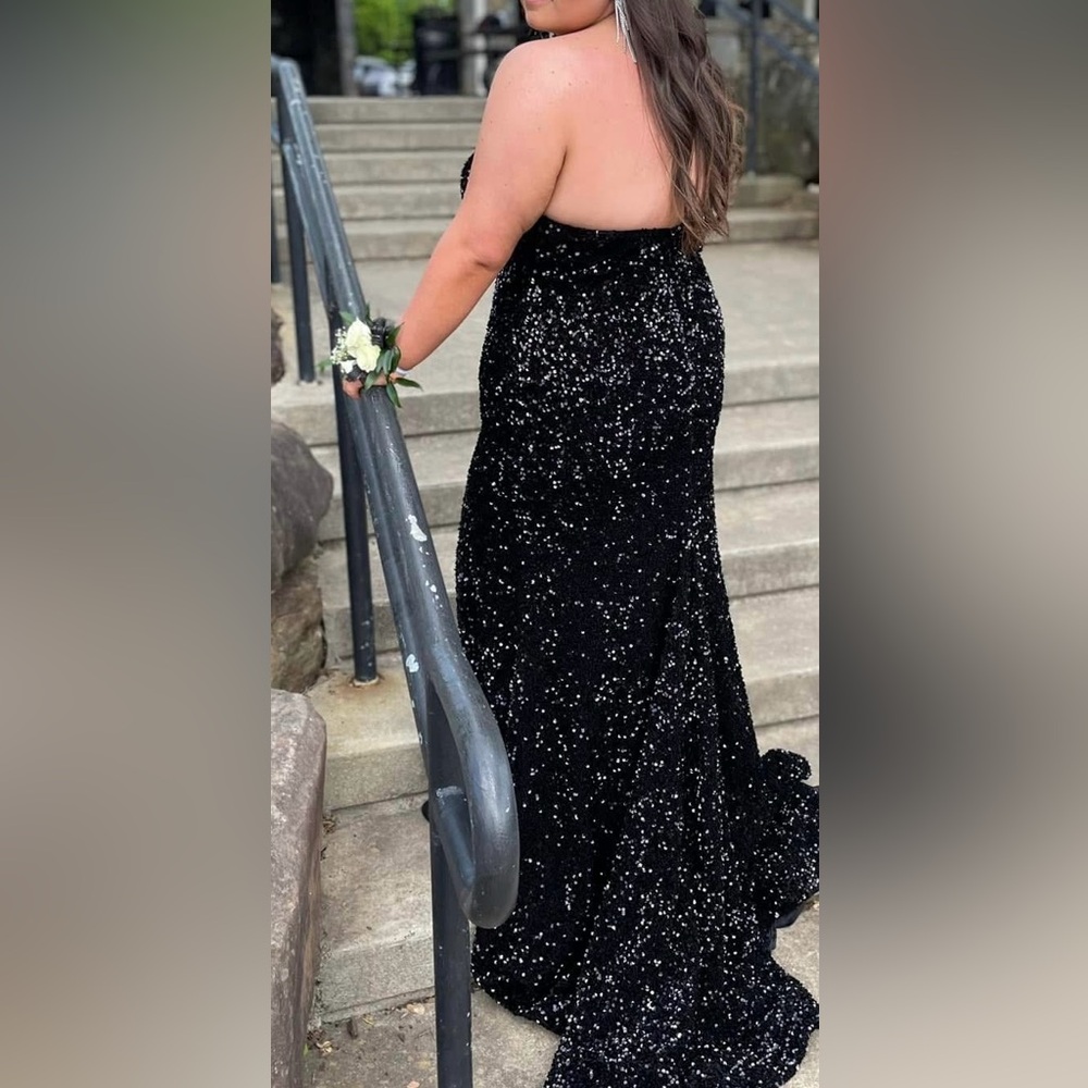 Black sequined plus size Sherri Hill formal gown.
